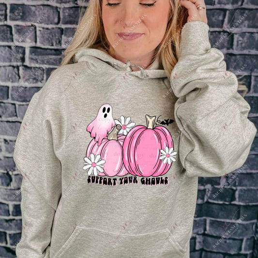 Pink pumpkins with a ghost, white flowers, and a black bat. Below are the words support your ghouls. Breast cancer awareness design